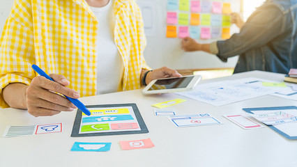 Wall Mural - creative web designer planning application and developing template layout, framework for mobile phon