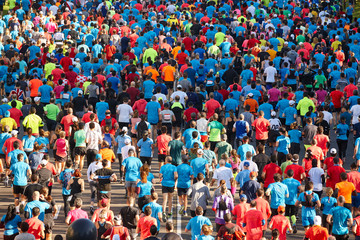 Runners on the street. Athletes in motion. Urban competition