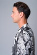 © Ranta Images - Profile view of handsome Hispanic tourist man