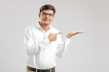 Sticker - Indian young man showing direction with hand