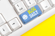 Text sign showing Blog Daily. Business photo showcasing Daily posting of any event via internet or media tools White pc keyboard with empty note paper above white background key copy space