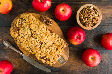 Wall Mural - Apple and walnut bread and fresh fruits on wooden rustic table, top view