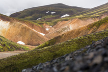 Icelandic Landscape With The Sloping Colored Hills Of Landmannalaugar Under A Cloudy Sky