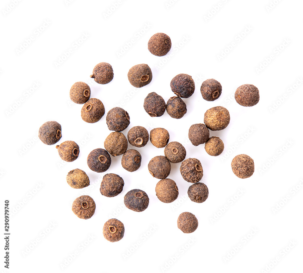 Allspice berries (also called Jamaican pepper or newspice) over white background. top view - obrazy, fototapety, plakaty 
