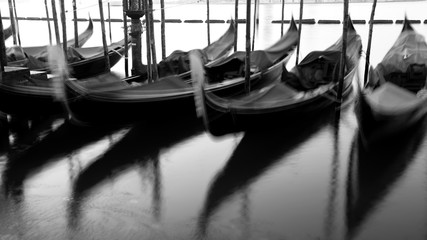 Gondolas by Saint Mark square at sunrise, Venice, Ita B&Wly