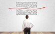 © ra2 studio - Businessman in doubt looking to a maze and searching the way out