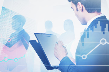 Poster - Businessman with clipboard and team in city, chart