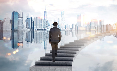 Canvas Print - Businessman climbing stairs in city