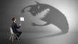 © ra2 studio - Young businessman staying and negotiate with a monster shadow