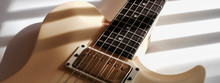 White Electric Guitar . Color Background  With Copy Space 
