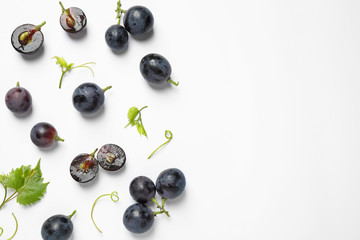 Wall Mural - Fresh ripe juicy grapes on white background, top view