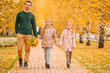 © travnikovstudio - Family of dad and kids on beautiful autumn day in the park