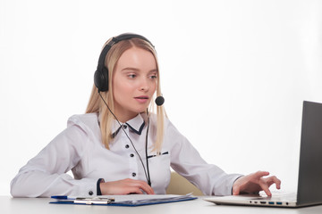 Portrait of happy smiling female customer support phone operator at workplace.