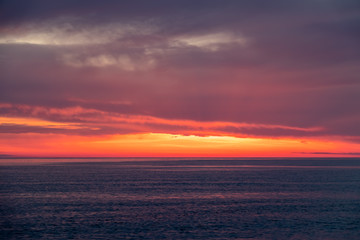 Wall Mural - Beautiful red and orange sunset over the sea.