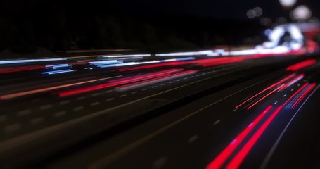 Poster - timelapse of highway traffic by night with speeding cars - busy traffic on highway road with blurred