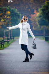 Wall Mural - middle-aged woman walking in city park
