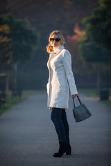 Wall Mural - middle-aged woman walking in city park