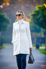 Wall Mural - middle-aged woman walking in city park