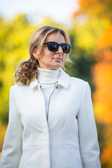 Wall Mural - middle-aged woman walking in city park
