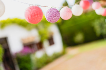 Round garlands of colors hung in country house.