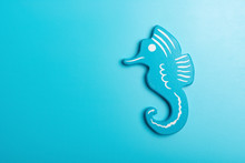 Toy Seahorse On Blue Background With Copy Space