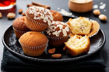 Wall Mural - Homemade muffins with almond flakes and raspberry jam.