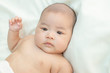 © Johnstocker - Cute little baby looking into the camera