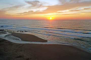 Wall Mural - Aerial from Monte Clerigo at the west coast in Portugal at sunset