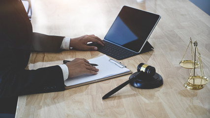 law legal technology concept. cropped shot lawyer using tablet on table.