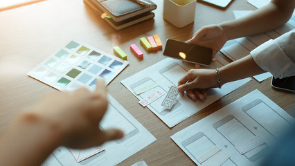 Closeup Ux Ui designer meeting on creative development table.