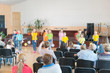 © jollier_ - Performance by talented children. Children on stage perform in front of parents. image of blur kid 's show on stage at school , for background usage. Blurry
