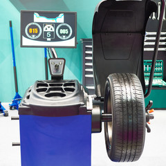 Poster - Stand for balancing wheels of car