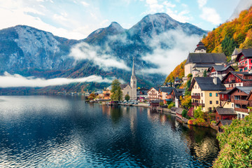 misty autumn scene of hallstatt lake. splendid morning viev of hallstatt village, in austria's mount