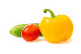 Fototapeta Na ścianę - Closeup image of vegetables festive three colors group. Red tomato, green cucumber and yellow pepper isolated at white background.