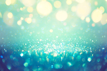 Wall Mural - christmas defocused - teal green and blue dust with bokeh lights
