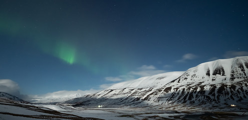 Wall Mural - northern lights aurora borealis over akureyri city in iceland