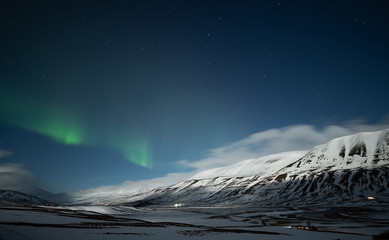Wall Mural - Northern lights aurora borealis over Akureyri city in Iceland