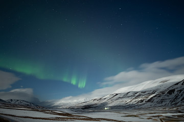 Wall Mural - Northern lights aurora borealis over Akureyri city in Iceland