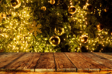 Wall Mural - top of empty wood table with beautiful christmas tree and lights backdrop. ready for your product di
