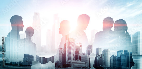 Fotografía Double exposure image of many business people conference group meeting on city office building in background showing partnership success of business deal