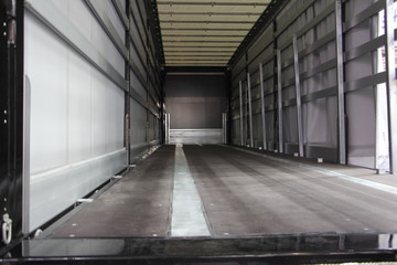 Wall Mural - New truck empty semi trailer inside rear view close-up, lorry transportation logistics