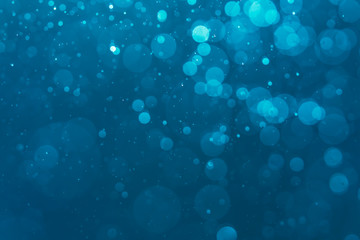 Abstract Blue bokeh defocus glitter blur background.