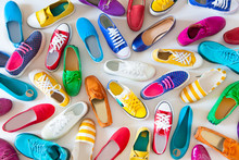 A Lot Of Colored Youth Women's Shoes Without Heels. Sneakers, Slippers, Ballet Shoes. White Background.