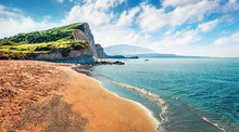 Exotic Spring Landscape Of Famous Xi Beach. Sunny Morning Scene Of Cephalonia Island, Greece, Europe. Bright Seascape Of Ionian Sea. Traveling Concept Background.