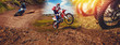 Banner rider on mountain dirtbike enduro participates in motocross, jumps on springboard against background dirt. Concept extreme action sport racing