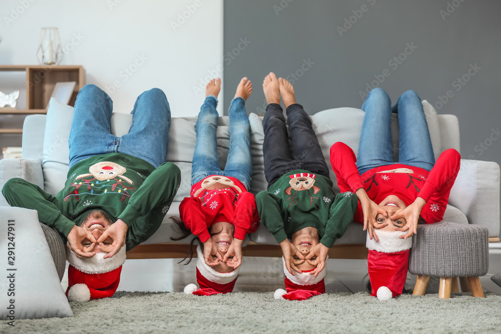 Funny family at home on Christmas eve