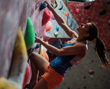 Athletic Woman Practicing In A Bouldering Gym