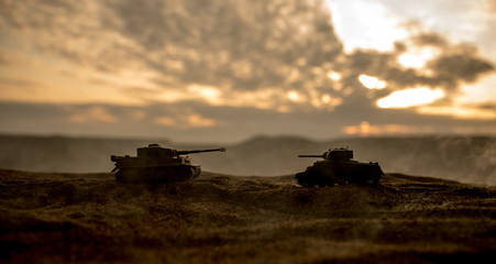 War Concept. Military silhouettes fighting scene on war fog sky background, World War German Tanks Silhouettes Below Cloudy Skyline At night. Attack scene.