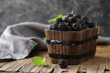 Poster - black raspberry blackberry on a wooden table