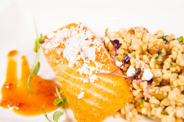 Sticker - Salmon with pearl barley with mushrooms, and lemon powder